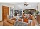 Spacious living room featuring skylights, hardwood floors, and comfortable furnishings at 4241 S Meadow Brook Ln, Evergreen, CO 80439