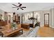 Spacious bedroom features hardwood floors, wooden accents, and an open layout with a sitting area at 4241 S Meadow Brook Ln, Evergreen, CO 80439