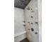 Walk-in shower with intricate tile work, a built-in bench, and multiple shower heads at 4241 S Meadow Brook Ln, Evergreen, CO 80439