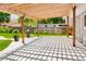 A spacious backyard features a large pergola and a well-manicured lawn at 1856 S Monroe St, Denver, CO 80210