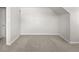Finished basement with neutral carpet and trim offers versatile space and clean lines at 1856 S Monroe St, Denver, CO 80210