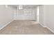 The basement has neutral carpet flooring and includes built-in storage at 1856 S Monroe St, Denver, CO 80210