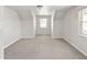 Neutral bedroom featuring natural light and carpet, making it a cozy place for a bedroom or a flex room at 1856 S Monroe St, Denver, CO 80210