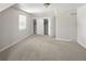 Light-filled bedroom features closet, window, and neutral tones, creating a serene and inviting space at 1856 S Monroe St, Denver, CO 80210