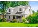 Charming two-story home with landscaped yard and a combination of lap siding and stucco at 1856 S Monroe St, Denver, CO 80210