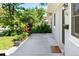 Exterior view of a home showcasing lush landscaping and a charming walkway to the front entrance at 1856 S Monroe St, Denver, CO 80210