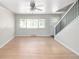 Spacious living room with hardwood floors, large windows, and minimalist decor, creating a welcoming atmosphere at 1856 S Monroe St, Denver, CO 80210