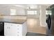 Bright living room area featuring great natural light and a view to the kitchen bar at 1856 S Monroe St, Denver, CO 80210