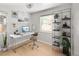 Inviting home office setup with modern desk, chair, and ample natural light at 1856 S Monroe St, Denver, CO 80210