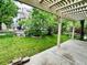 View of the backyard with green grass from the covered patio at 6102 S Yampa St, Aurora, CO 80016