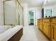 Bathroom featuring a garden tub and shower at 6102 S Yampa St, Aurora, CO 80016