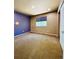 Bedroom with neutral decor and a large window at 6102 S Yampa St, Aurora, CO 80016