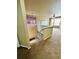 View of the open hallway with stairway and plush carpeting at 6102 S Yampa St, Aurora, CO 80016