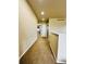 Hallway with plush carpeting and bright recessed lighting at 6102 S Yampa St, Aurora, CO 80016