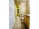 Functional laundry room with tile flooring, a window, toilet, and vanity at 6102 S Yampa St, Aurora, CO 80016