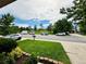 Street view showcasing the front yard, neighborhood surroundings, and community green space at 6102 S Yampa St, Aurora, CO 80016