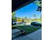 Residential street view with cars parked along the curb, nearby park and school bus at 6102 S Yampa St, Aurora, CO 80016
