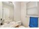 Clean bathroom featuring a vanity, toilet, mirror, and towel rack, with bright natural light at 4710 N Foxtail Dr, Castle Rock, CO 80109
