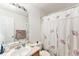 Bathroom featuring a single sink vanity and a shower with a floral curtain at 4710 N Foxtail Dr, Castle Rock, CO 80109