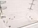 A jetted bathtub with tile surround and chrome fixtures for a relaxing bath experience at 4710 N Foxtail Dr, Castle Rock, CO 80109