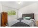 Bedroom with a large window, dresser and carpeted flooring at 4710 N Foxtail Dr, Castle Rock, CO 80109