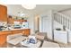 Bright dining area featuring a table and chairs adjacent to the kitchen and staircase at 4710 N Foxtail Dr, Castle Rock, CO 80109