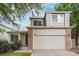 Charming two-story home featuring a two-car garage and classic brick accents at 4710 N Foxtail Dr, Castle Rock, CO 80109