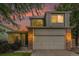 Charming two-story home with brick accents, attached garage, and beautiful sunset backdrop at 4710 N Foxtail Dr, Castle Rock, CO 80109