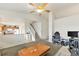 Open-concept living area with seamless transition to the kitchen and staircase at 4710 N Foxtail Dr, Castle Rock, CO 80109
