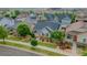 Aerial view of well-maintained homes with manicured lawns and mature trees in a desirable neighborhood at 3678 Shadow Cir, Castle Rock, CO 80109