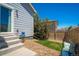 Enclosed backyard with convenient access to the home and easy to maintain landscaping and charming seating at 3678 Shadow Cir, Castle Rock, CO 80109