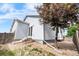 Well-maintained backyard featuring grey siding, rock landscaping, and a wood fence at 3678 Shadow Cir, Castle Rock, CO 80109