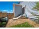 Cozy backyard with a private seating area, rock landscaping, green grass, and access to the home's entrance at 3678 Shadow Cir, Castle Rock, CO 80109