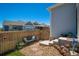 Secluded backyard featuring a wooden fence, comfortable bench, stone accents, and low-maintenance landscaping at 3678 Shadow Cir, Castle Rock, CO 80109