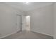 Carpeted bedroom with white walls, closet, and entry door at 3678 Shadow Cir, Castle Rock, CO 80109