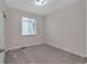 Carpeted bedroom with a window and blinds, allowing natural light to fill the space at 3678 Shadow Cir, Castle Rock, CO 80109