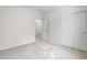 Bright, empty bedroom with neutral carpet and an open doorway to other rooms at 3678 Shadow Cir, Castle Rock, CO 80109