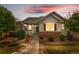 Charming single-story home with landscaped front yard, pathway lighting, and a welcoming front porch at 3678 Shadow Cir, Castle Rock, CO 80109