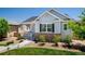 Charming single-story home with a well-maintained lawn, inviting porch, and brick accents on the front facade at 3678 Shadow Cir, Castle Rock, CO 80109