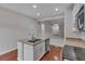 Bright kitchen with granite counters, stainless steel dishwasher, and hardwood floors at 3678 Shadow Cir, Castle Rock, CO 80109