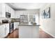 Modern kitchen with stainless steel appliances, white cabinetry, and granite countertops at 3678 Shadow Cir, Castle Rock, CO 80109