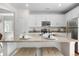Bright kitchen with white cabinets, granite countertops, and stainless steel appliances at 3678 Shadow Cir, Castle Rock, CO 80109