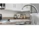 Charming kitchen featuring white cabinets, granite countertops, and stainless steel appliances at 3678 Shadow Cir, Castle Rock, CO 80109