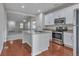 Modern kitchen featuring stainless steel appliances, granite countertops, and open to the living area at 3678 Shadow Cir, Castle Rock, CO 80109