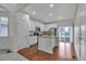Modern kitchen with white cabinetry and a sliding glass door to backyard at 3678 Shadow Cir, Castle Rock, CO 80109
