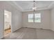 Spacious main bedroom featuring a stylish light fixture, bathroom, and large window at 3678 Shadow Cir, Castle Rock, CO 80109