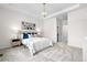 Serene bedroom with neutral tones, tray ceiling, and a chandelier light fixture at 3678 Shadow Cir, Castle Rock, CO 80109