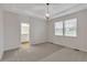 Spacious main bedroom featuring a stylish light fixture, bathroom, and large window at 3678 Shadow Cir, Castle Rock, CO 80109