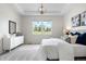 Serene bedroom features plush bedding, soft lighting, and a large window showcasing outdoor views and a trey ceiling at 3678 Shadow Cir, Castle Rock, CO 80109