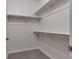 Walk-in closet featuring carpet flooring, white paint, and metal shelving at 3678 Shadow Cir, Castle Rock, CO 80109